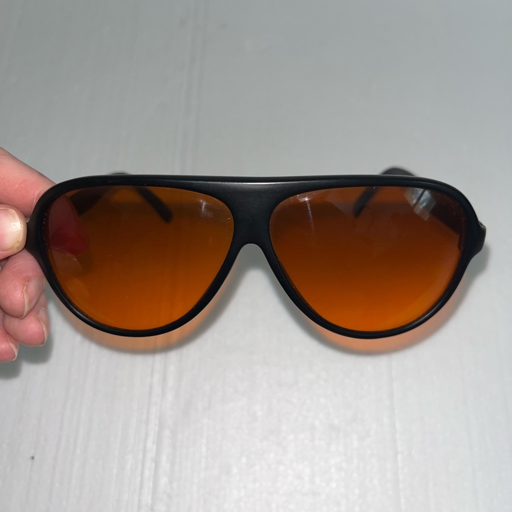 Sleek Black Sunglasses with Orange Lenses